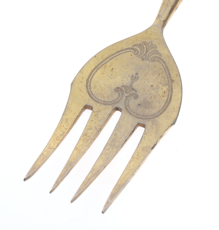 Silver fork with gilding