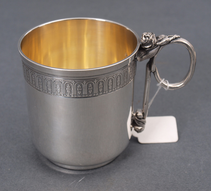 Silver cup with saucer 