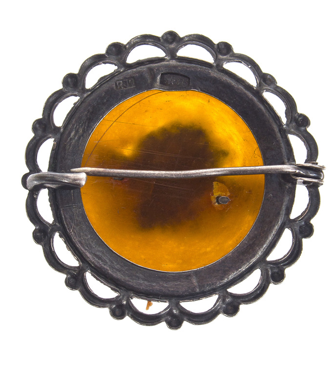 Silver brooch with amber 