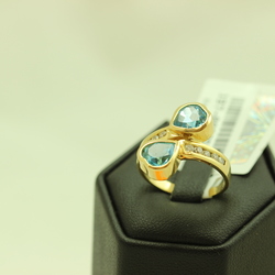 Gold ring with diamonds and topaz