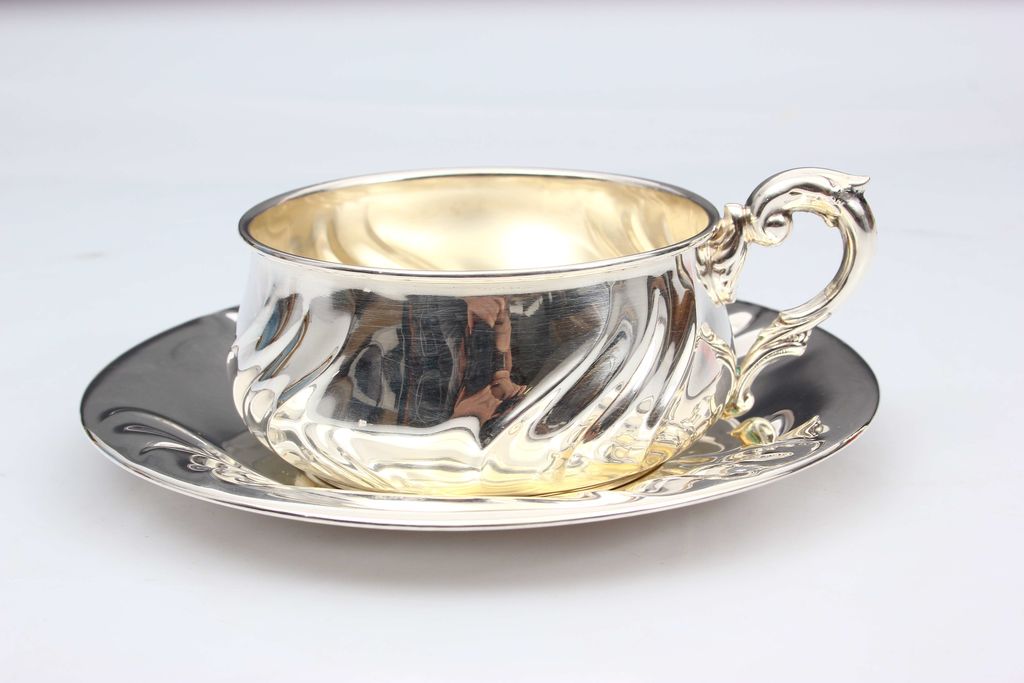 Silver mug with saucer in Baroque style