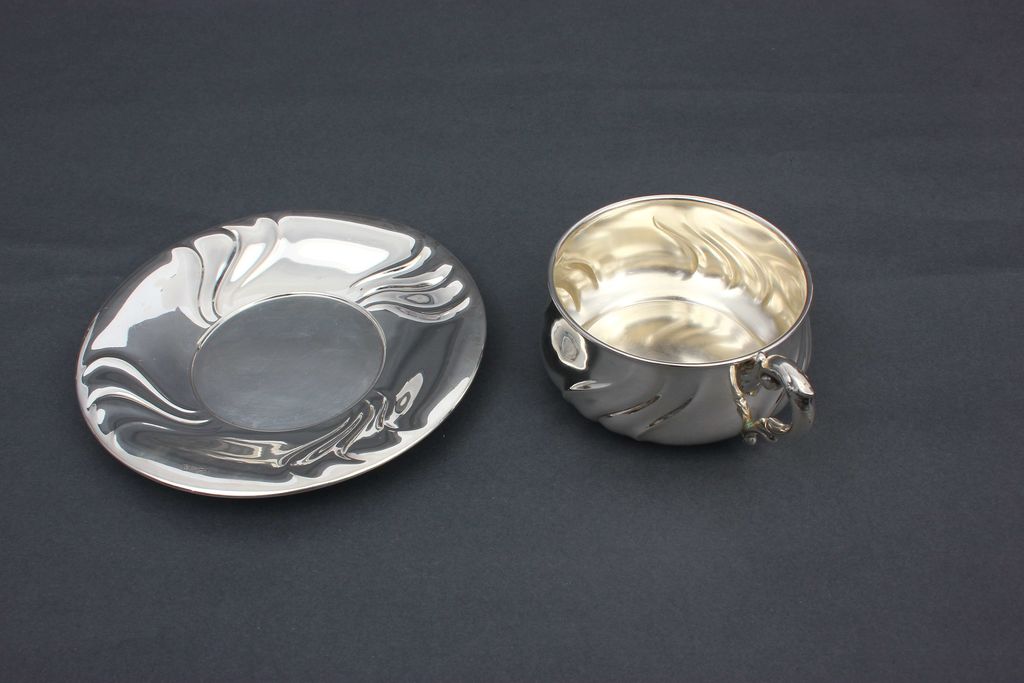 Silver mug with saucer in Baroque style