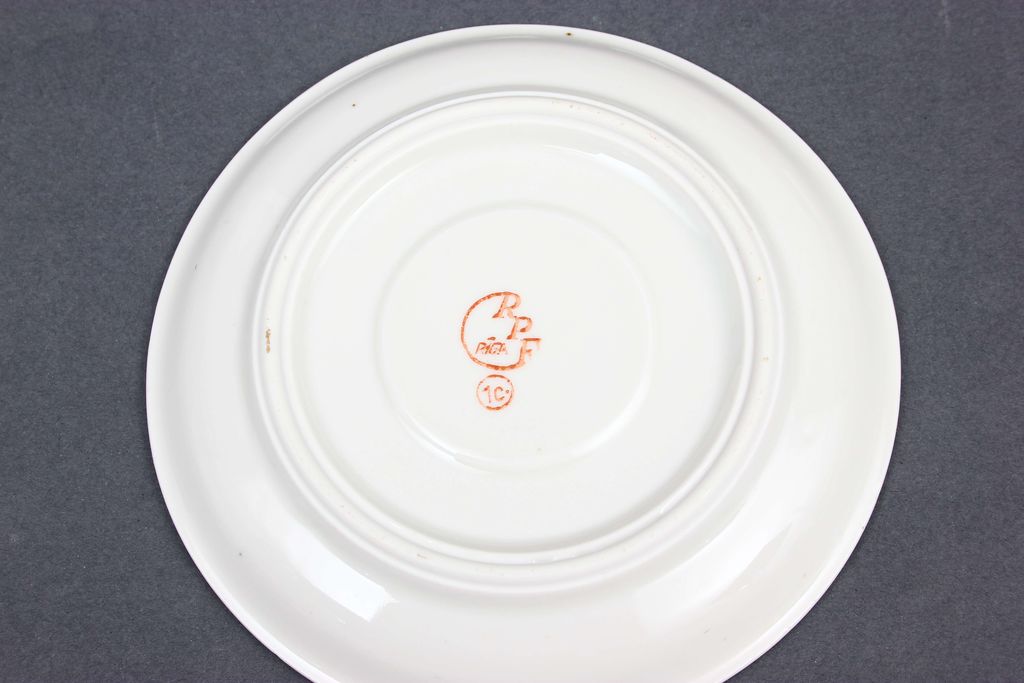 Porcelain saucers and plate (5 pcs.)
