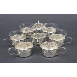 Silver glass holders (8 pcs.) and 7 glasses