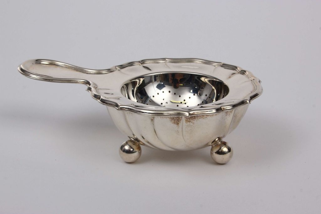 Baroque silver tea strainer and tray
