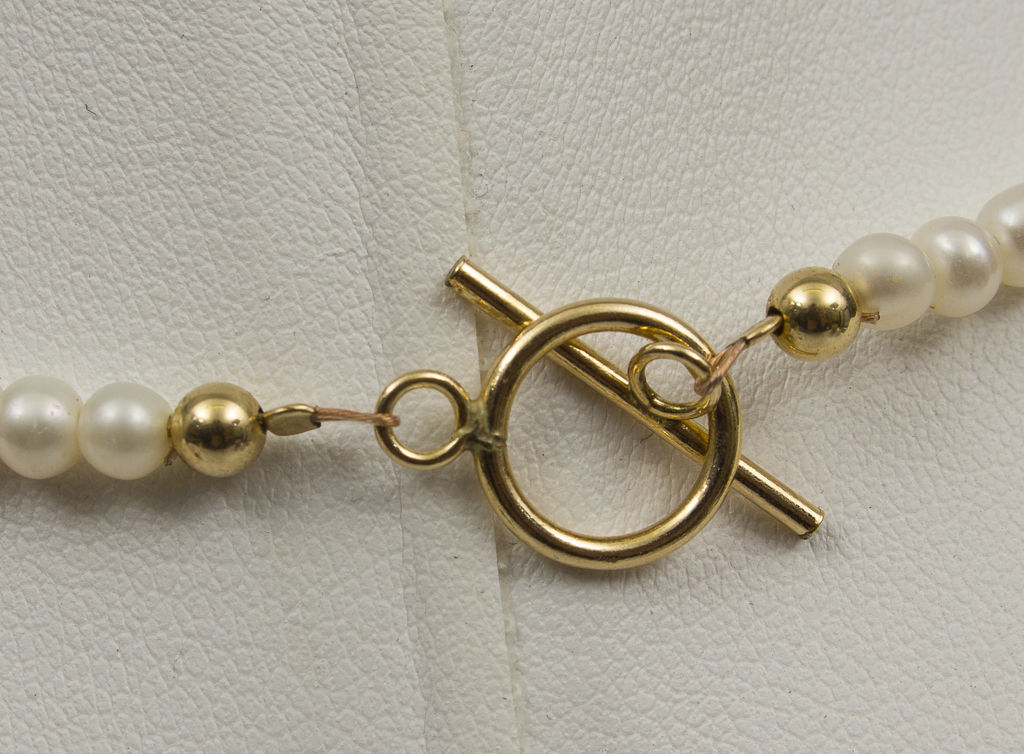 Жемчужное ожерелье с золотом