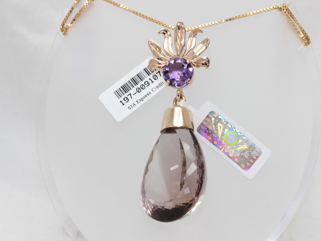 Gold pendant with amethyst and ametrine