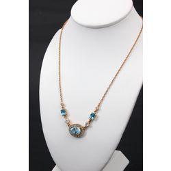 Gold necklace with topaz and zirconium