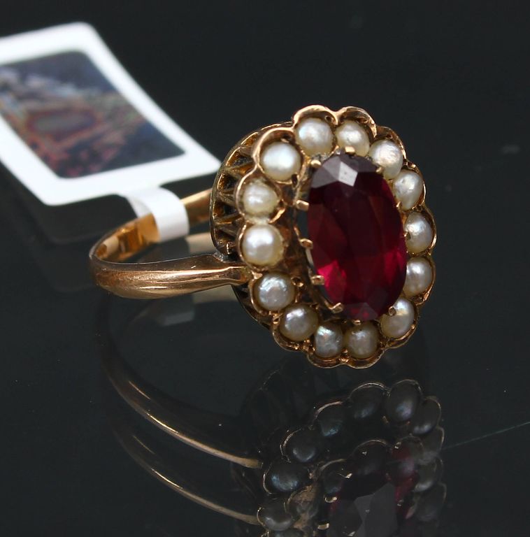 Golden ring with garnet