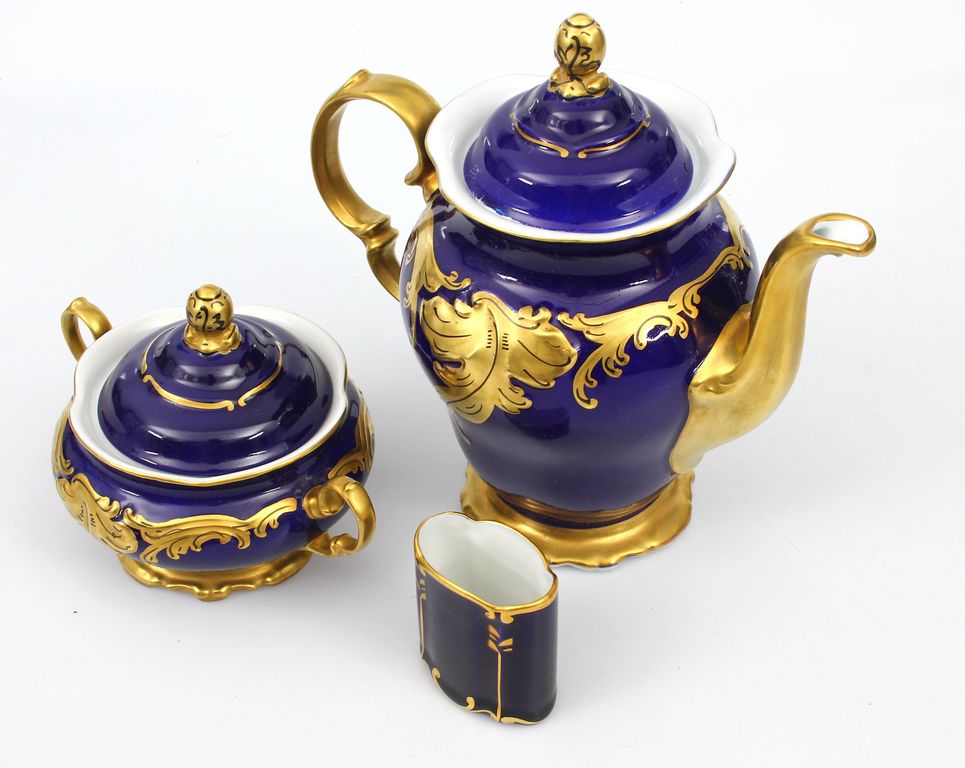 Porcelain set - teapot, sugar-basin, napkin holder