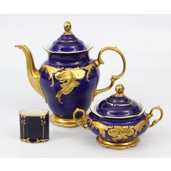 Porcelain set - teapot, sugar-basin, napkin holder