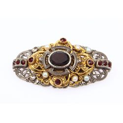Openwork brooch in oriental style with decorative stones