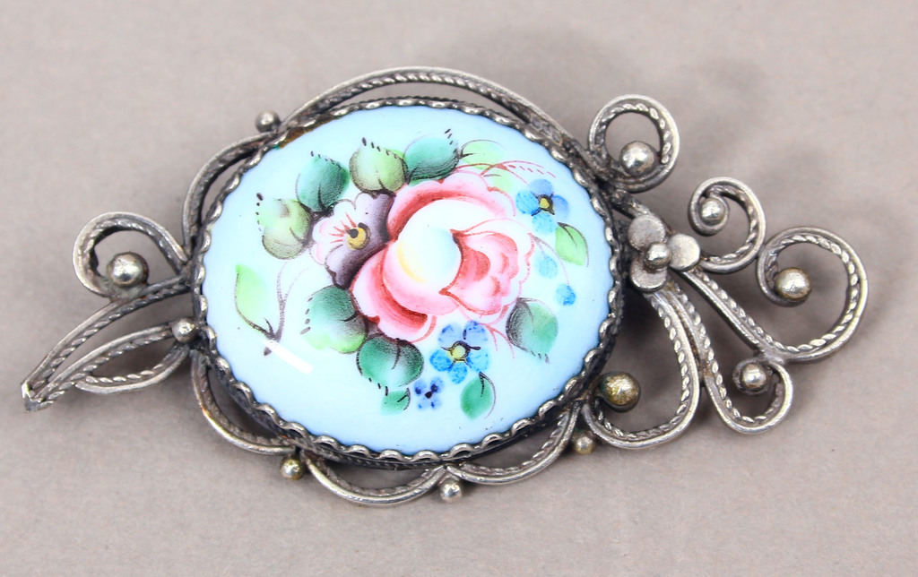Metal brooch with painting on porcelain