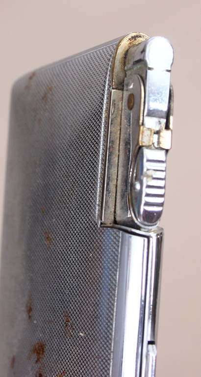 Metal cigarette case with integrated lighter, patent number  