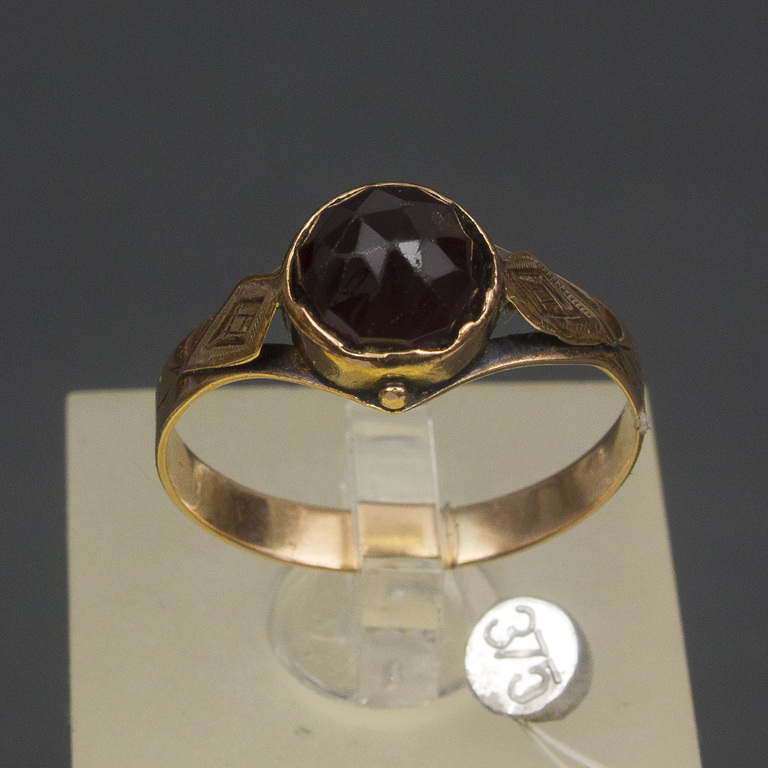 Golden ring with garnet