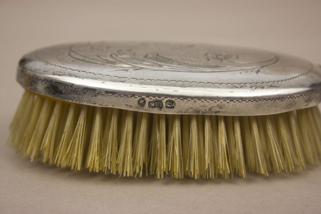 Comb in a silver frame