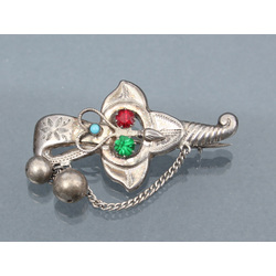 Silver brooch with colored glasses