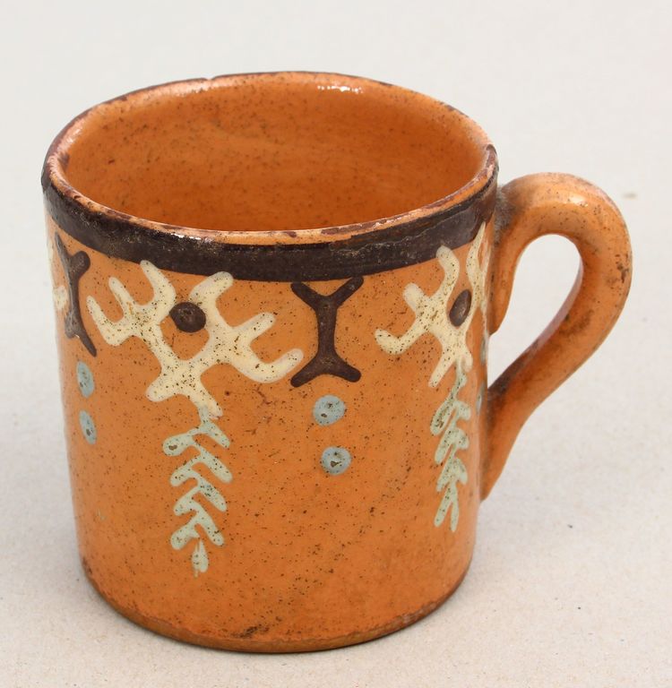 Ceramic cup with ornaments