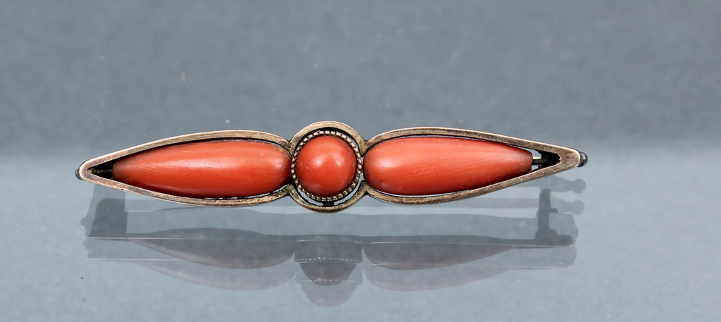 Silver brooch with coral