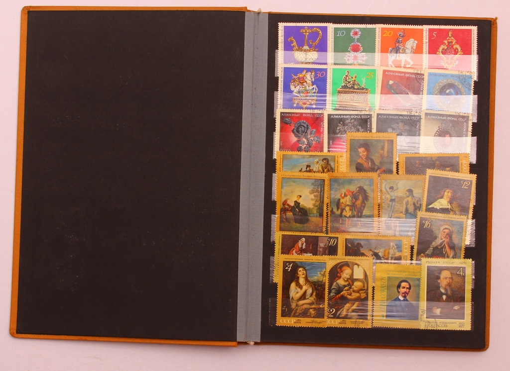 Four stamp albums (around 900 stamps)