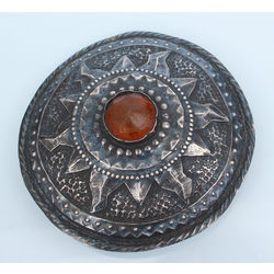 Silver brooch with melted amber 