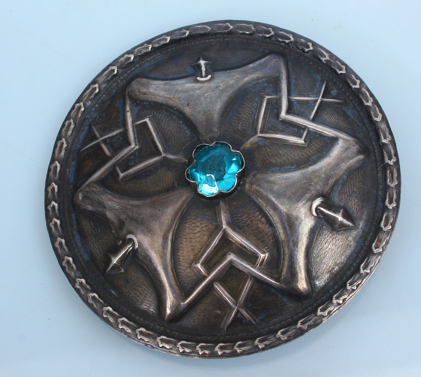 Silver brooch with blue stone