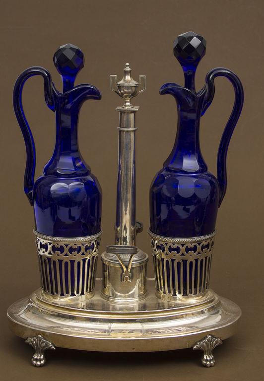 Two decanters for spices with silver tray