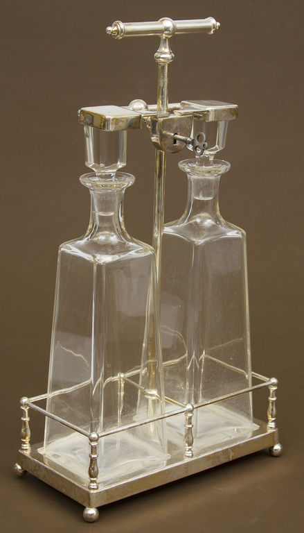 Decanter with secret, silver plated metal holder