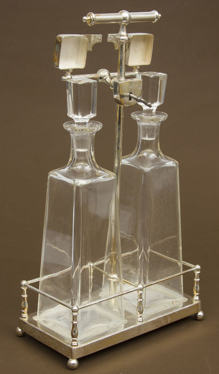 Decanter with secret, silver plated metal holder