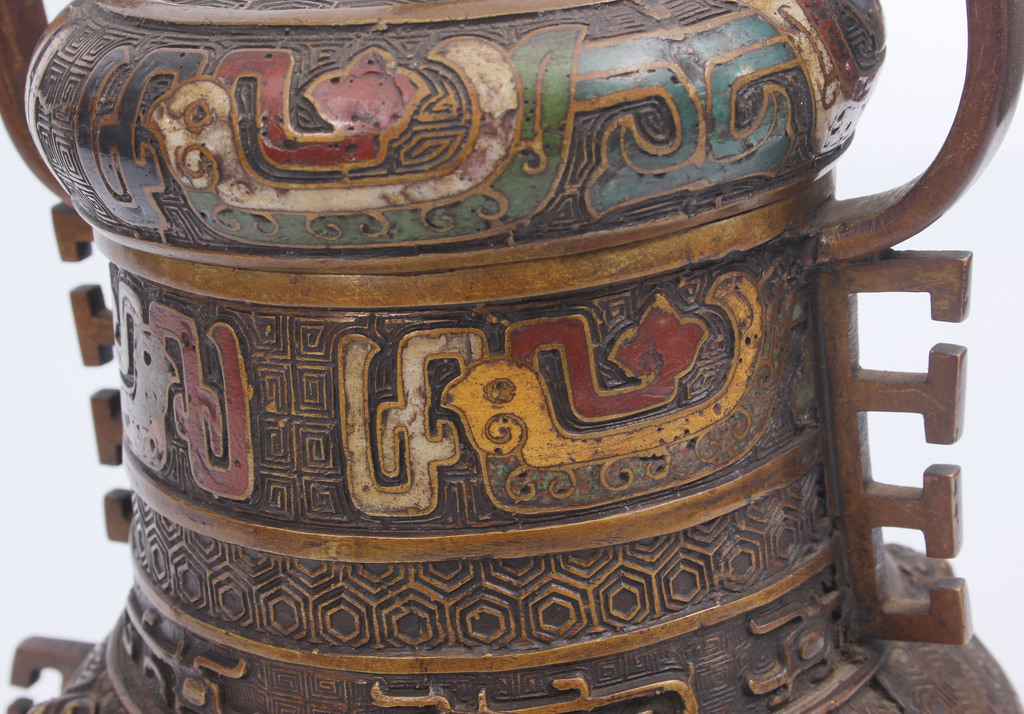 Bronze can with multi-colored enamel