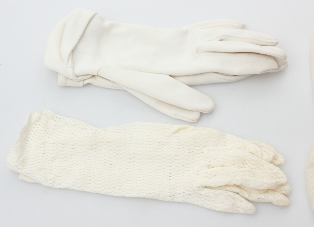 Four pairs of white women's gloves