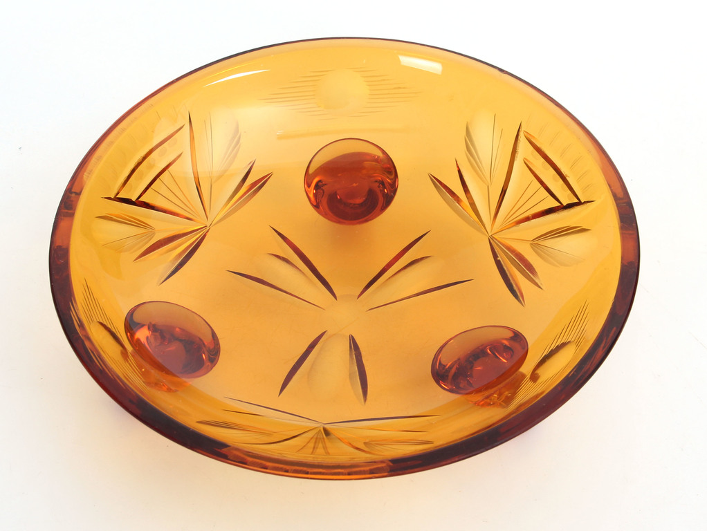 A small colored glass fruit bowl 