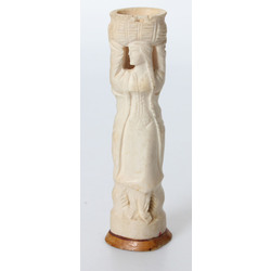 Bone vase on a wooden base 