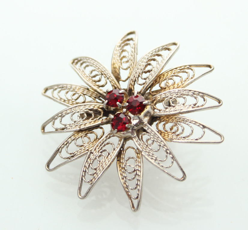 High proof silver brooch with garnets