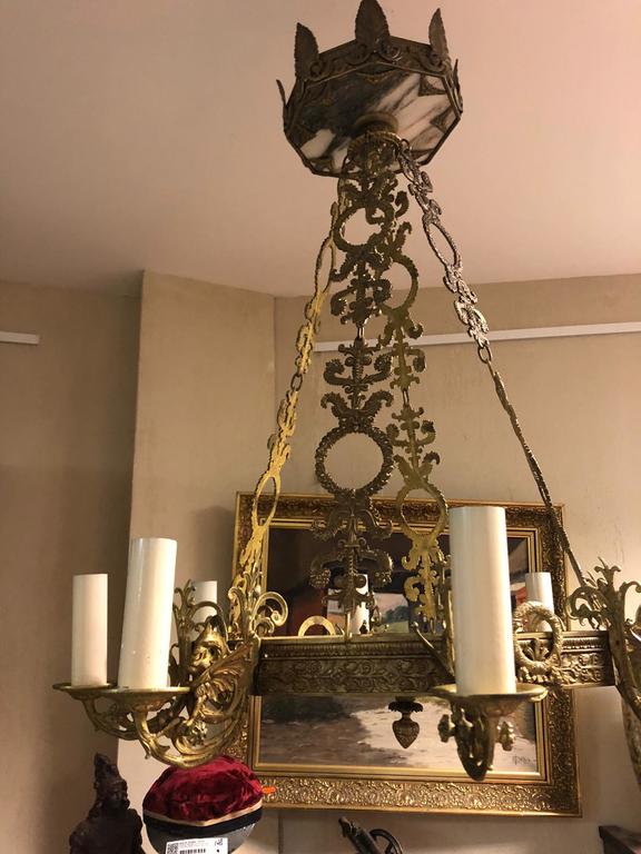 Bronze chandelier with marble slab