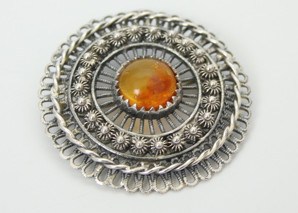 Art Nouveau silver brooch with amber