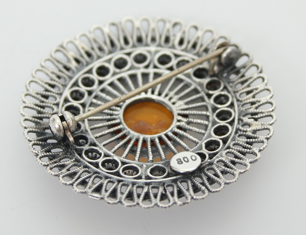 Art Nouveau silver brooch with amber