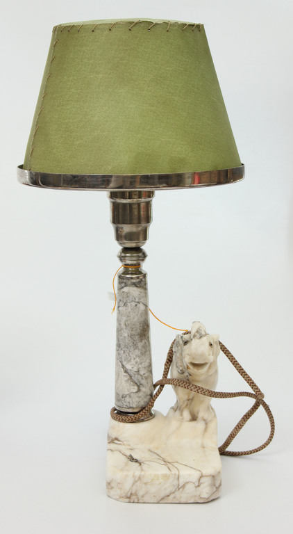 A marble lamp with a metal finish for “The Elephant,”