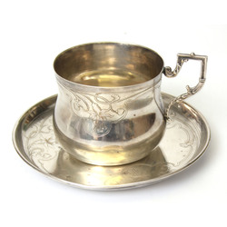 Silver mug with a plate