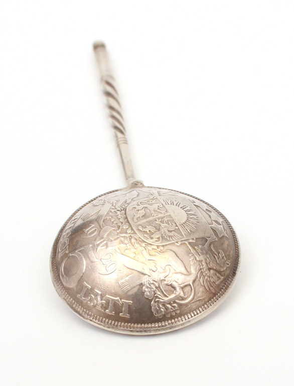 Silver spoon made from five lats coin