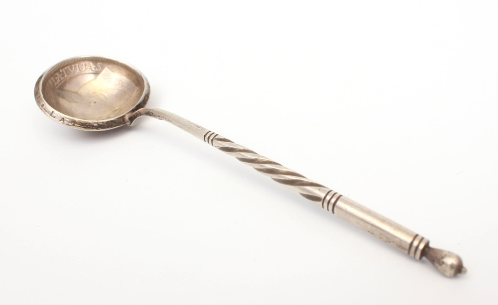 Silver spoon made from five lats coin