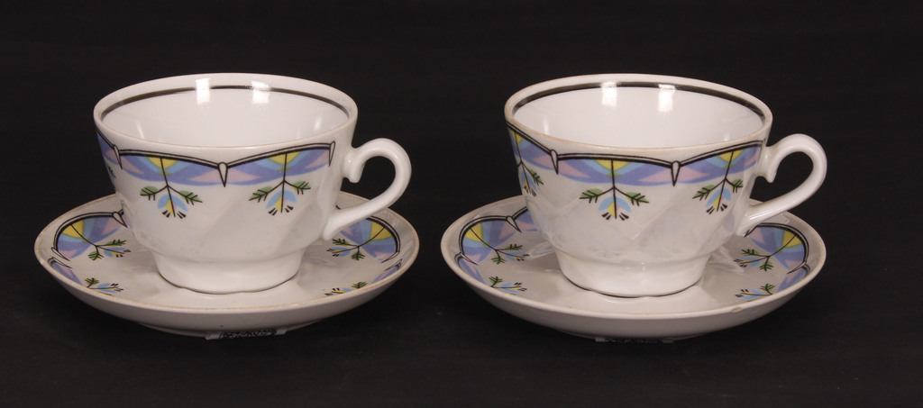 Two porcelain cups with saucers
