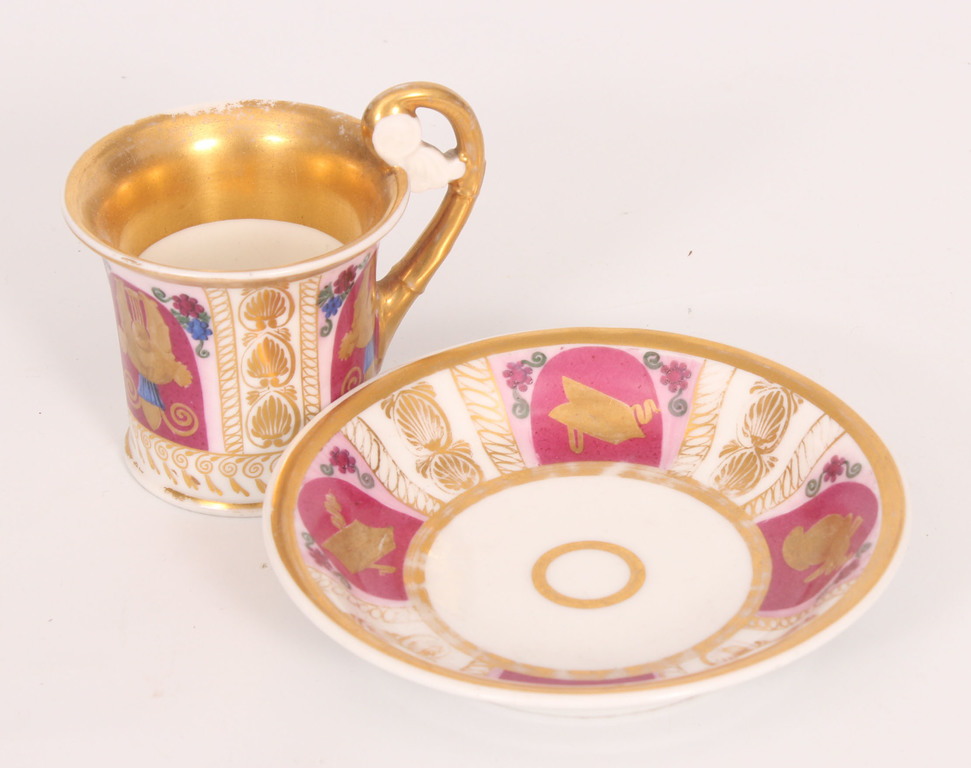 Hand painted porcelain cup with saucer