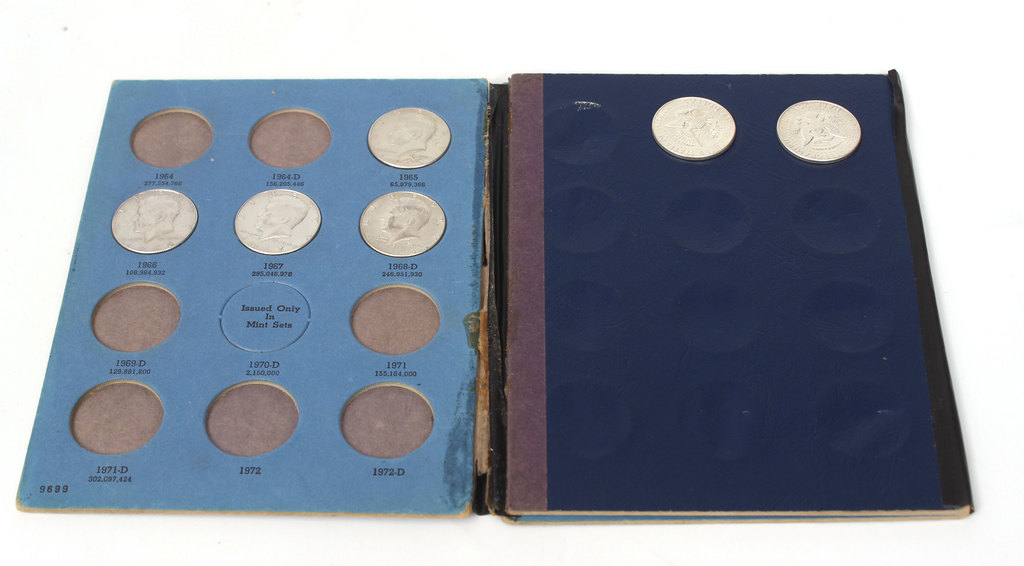 John F. Kennedy's half dollar coin collection album with 17 coins