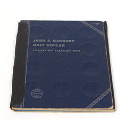 John F. Kennedy's half dollar coin collection album with 17 coins