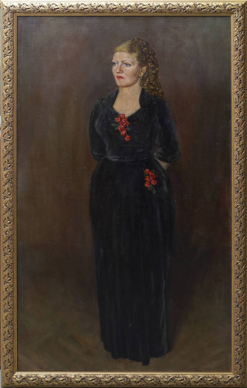 A woman in a black dress with red accents