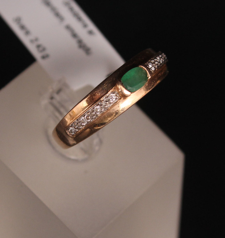 Gold ring with diamonds and emeralds