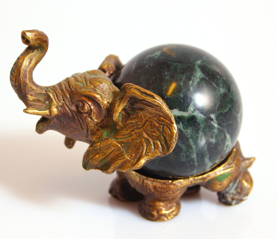 Bronze elephant with a stone ball