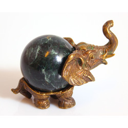 Bronze elephant with a stone ball