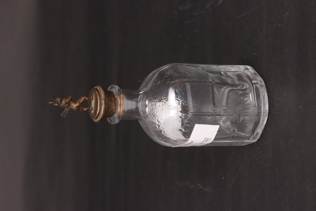Glass carafe with bronze cork